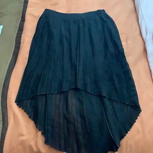 Pleated high low skirt with attached slip